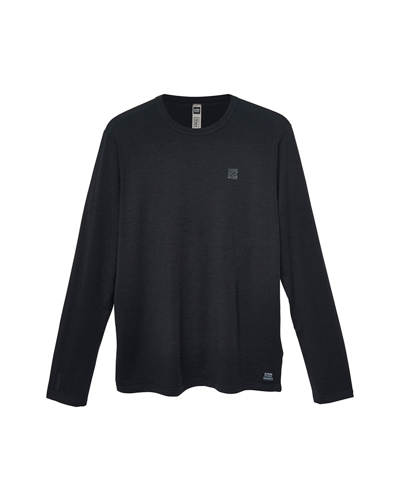 XTM Adventure170 merino long sleeve thermal in black, laid flat, front view with chest logo