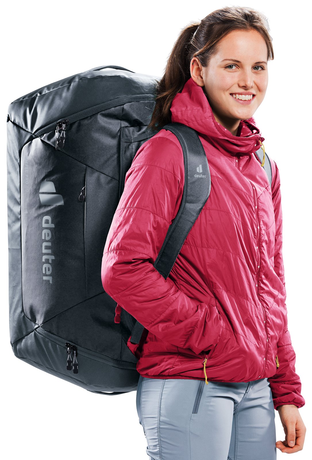 Woman carrying the Deuter Duffel Pro 60 in Black as a backpack