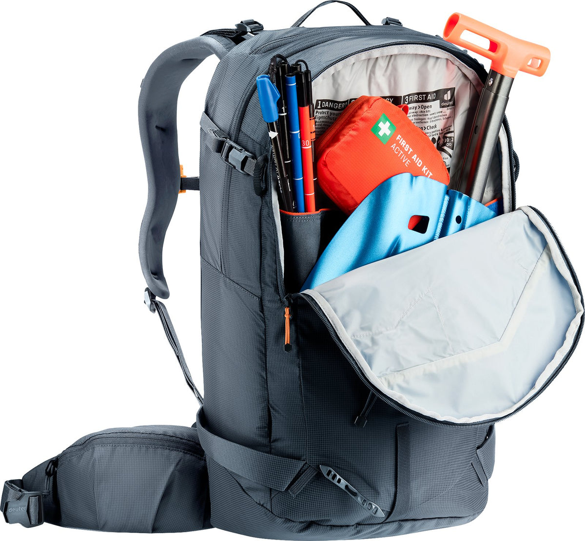 Deuter Freerider 30 front pocket open with a shovel blade, probe and first aid kit