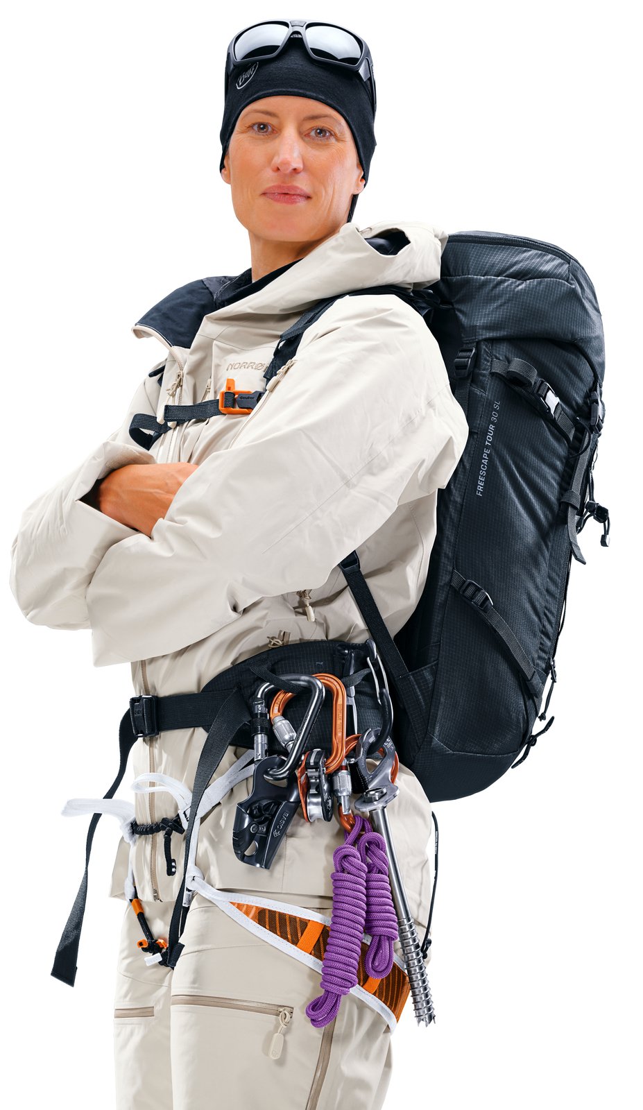 Ski mountaineer wearing the Deuter Freescape Tour 30 SL over a harness with gear on the hip fin