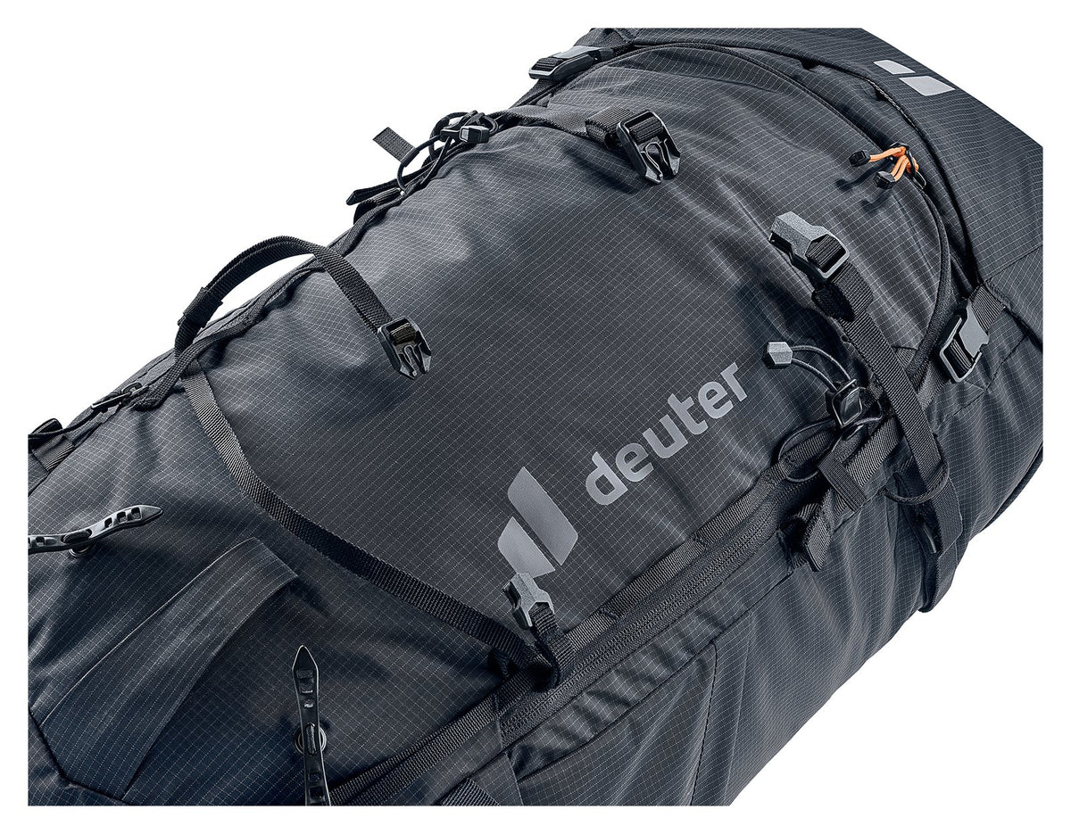 Close-up of the Deuter Freescape Tour 40 roll-top and lid straps