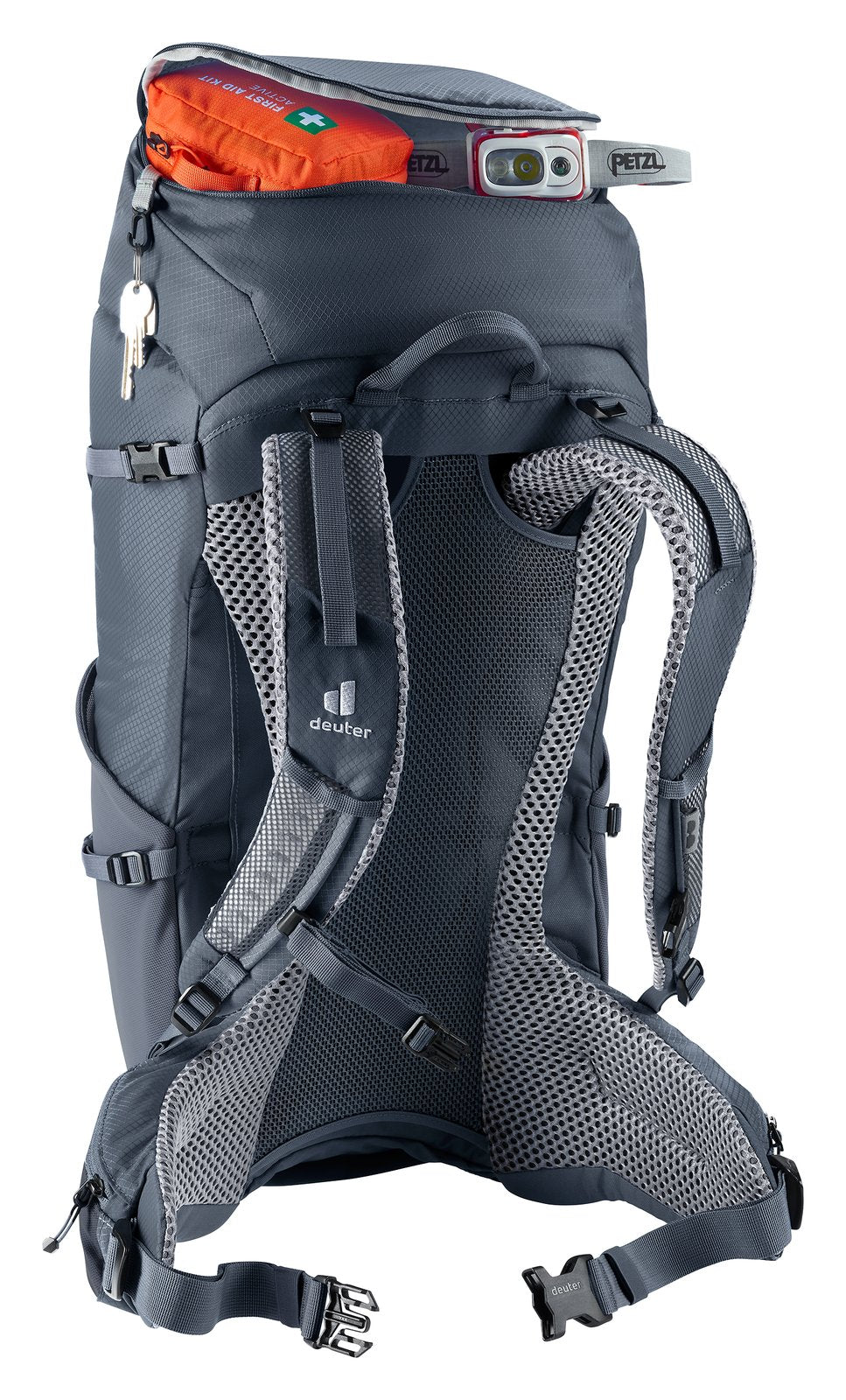 Deuter Futura 32 lid pocket open with a first aid kit and head torch, keys hanging from the key clip