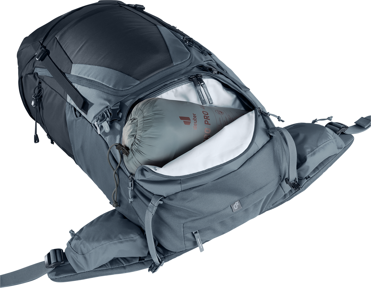 Deuter Futura Air Trek 55+10 SL lower zip open with a sleeping bag below the divider