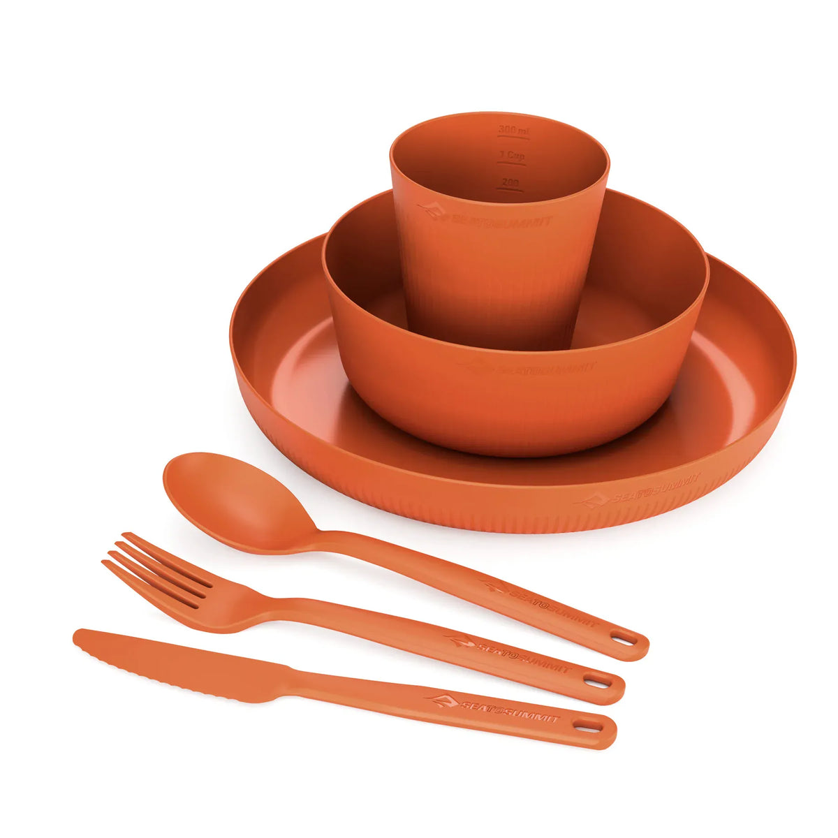 Close view of the Burnt Orange Camp Dinnerware Set stacked, with spoon, fork and knife in front