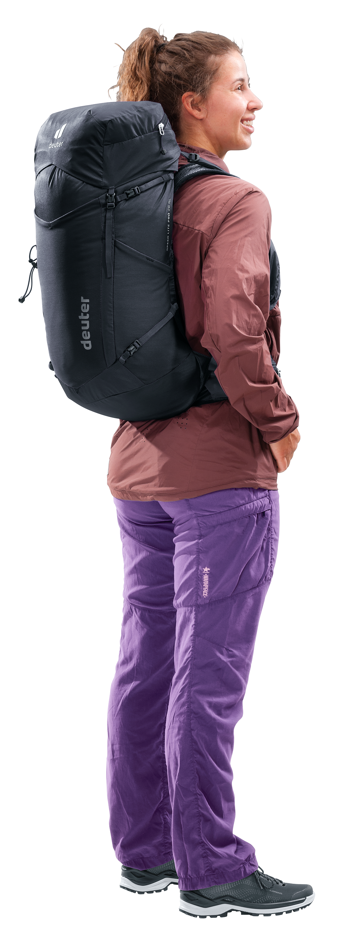 Woman wearing the Deuter Speed Lite Pro 28 SL, side view showing the fit