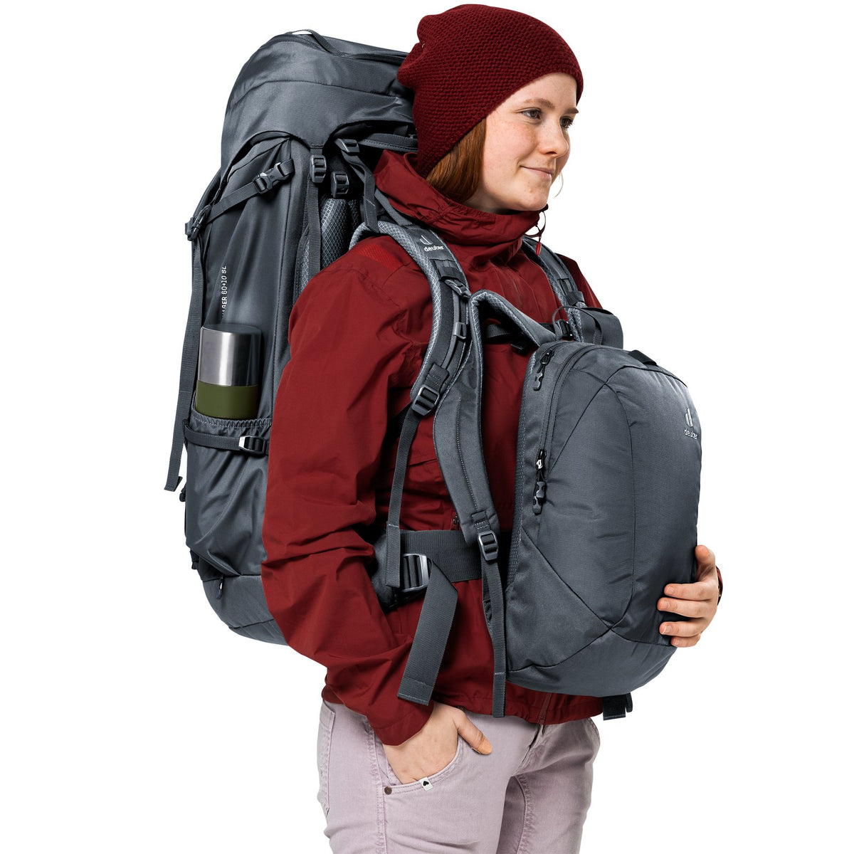 Woman wearing the Deuter Voyager 60+10 SL with the daypack clipped to her chest