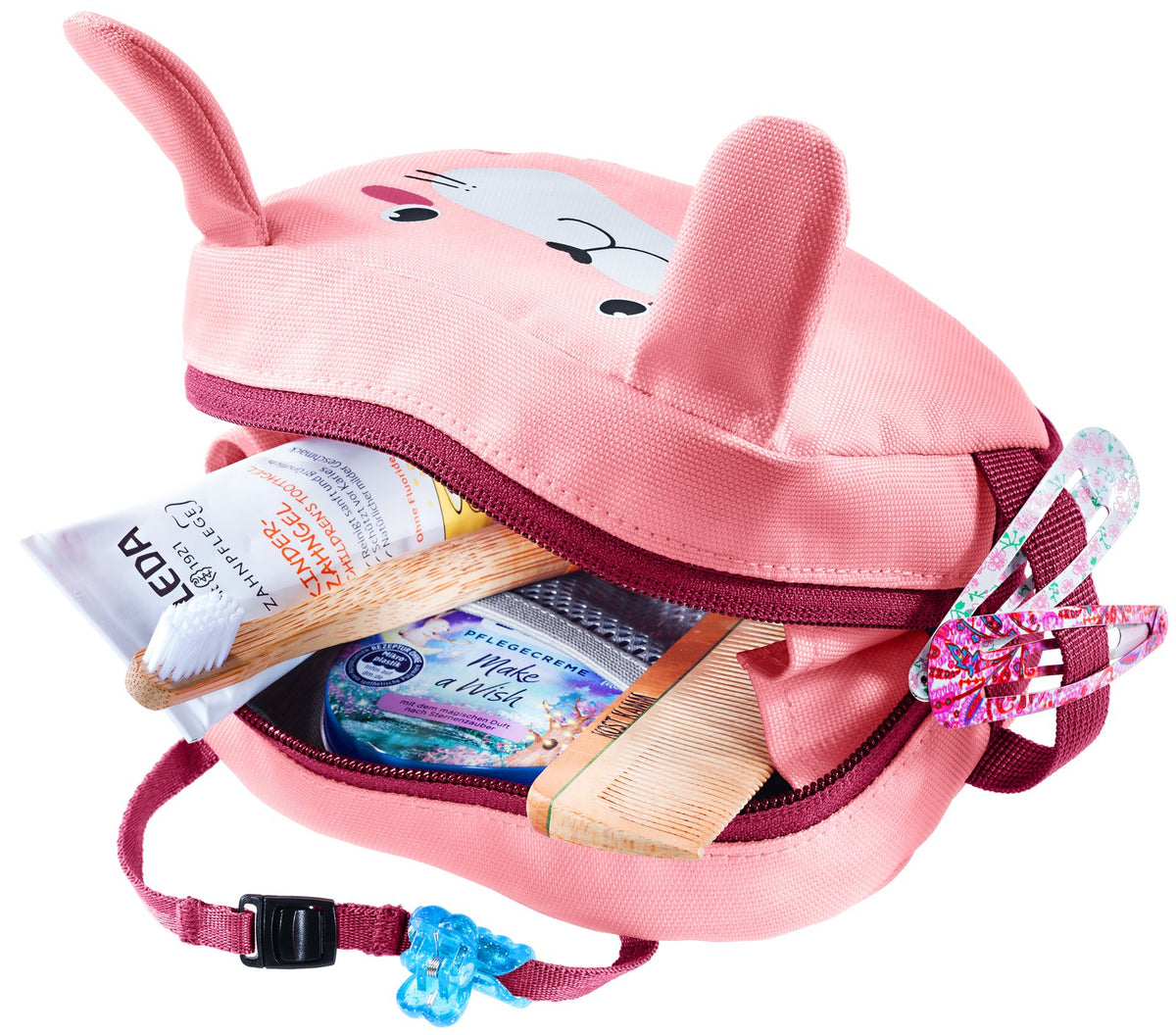 Deuter Wash Bag Kids in Blossom Raspberry unzipped with toothpaste and toiletries inside