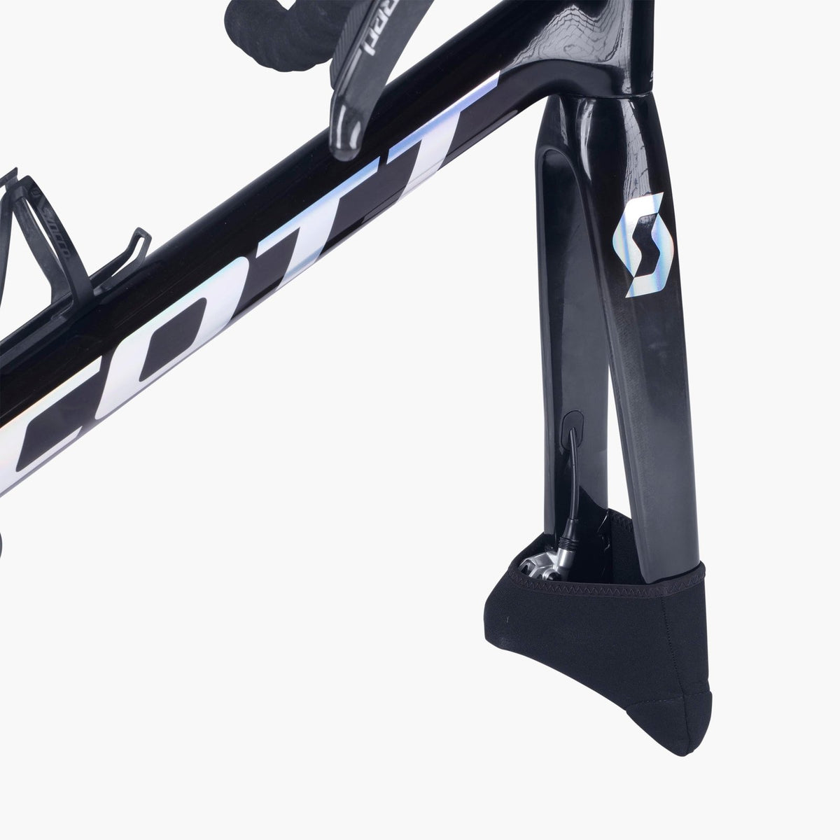Black protective cap fitted over the fork dropouts of a road bike with its front wheel removed