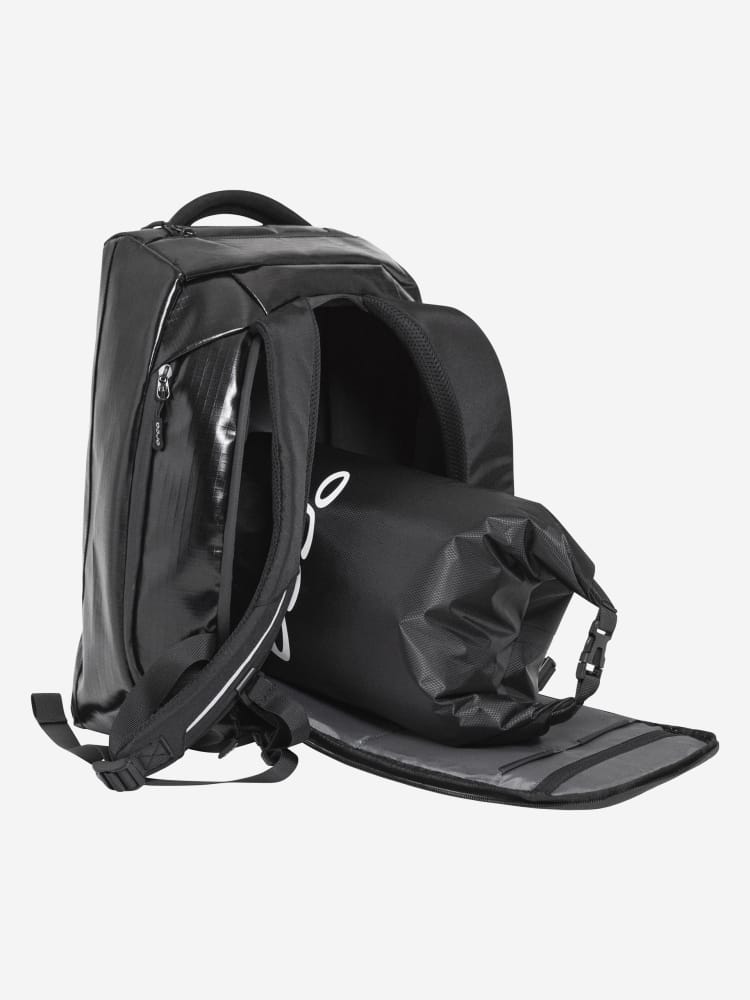 Orca Training Backpack with the U-zip back panel open and a roll-top waterproof bag inside