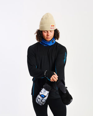 Model pulling on an XTM Valentino Ascent mitt with the black velcro cuff and wrist leash