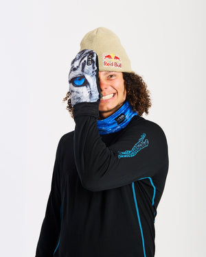 Smiling rider covering one eye with an XTM Valentino Ascent Snow Leopard print mitt