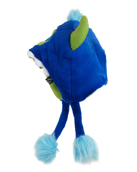 Side view of the XTM Kids Furble Monster earflap beanie showing a green horn and blue pom pom ties
