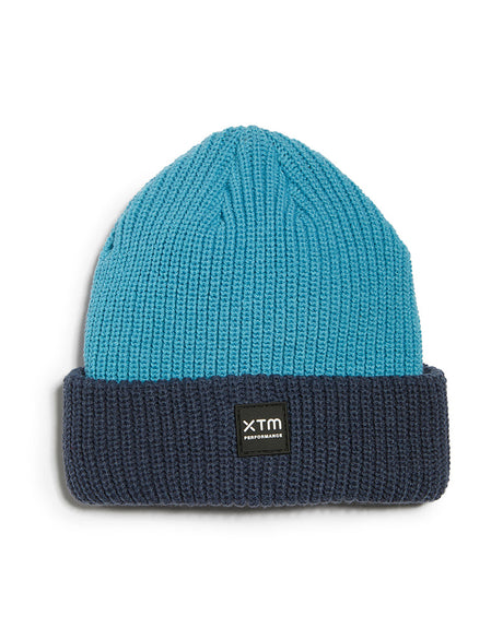 Retro Blue XTM Kids Hideaway Beanie with aqua rib-knit crown, navy cuff and black XTM badge