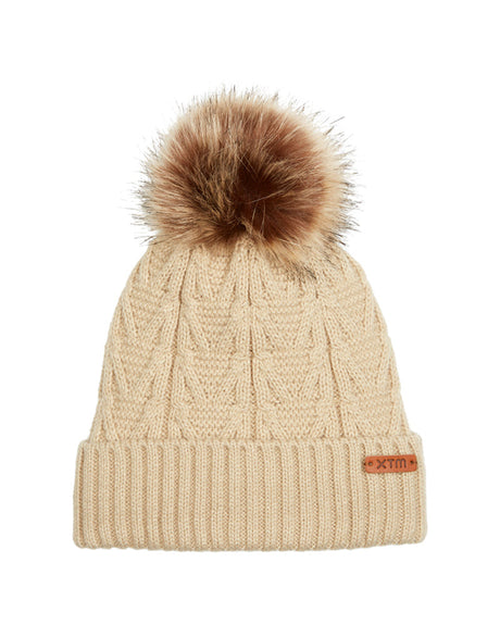 Almond XTM Kids Isla Knit Beanie, cream cable knit with roll-up cuff, tan badge and fur pom pom