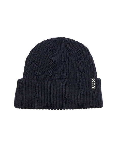 Navy XTM Kids Slushy Beanie in dark rib knit with folded cuff and vertical woven XTM label