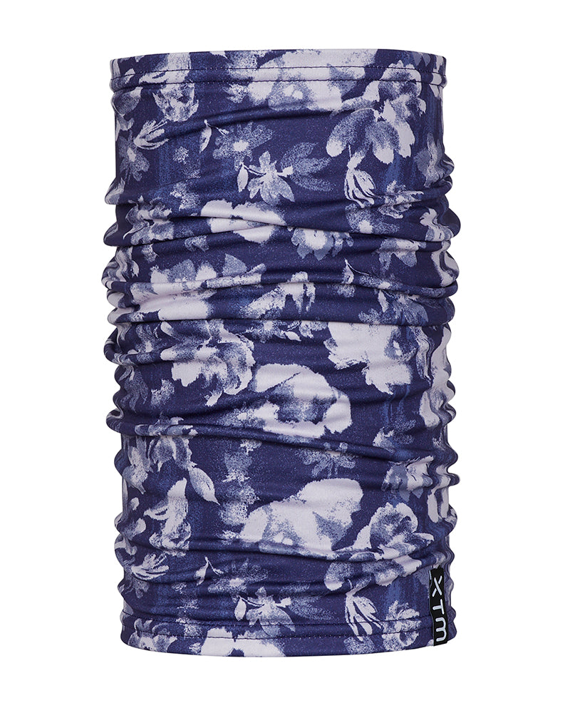XTM Tempo neck tube in Flowerfields, deep navy with a white and lilac floral print, standing upright