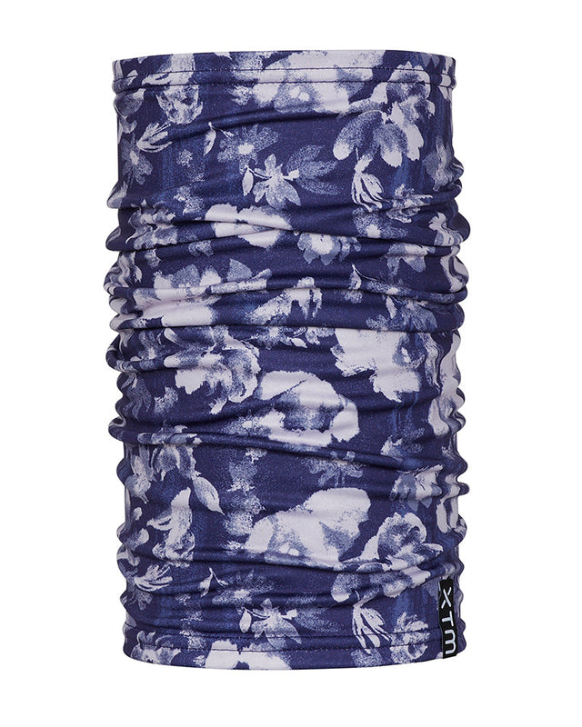 XTM Tempo neck tube in Flowerfields, deep navy with a white and lilac floral print, standing upright