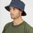 Man wearing the Indigo XTM Sundew hemp-cotton bucket hat, three-quarter view