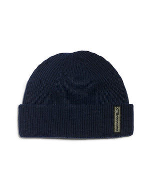 Navy XTM Casey double-walled knit beanie with roll-up hem and badge on the cuff