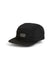 XTM Alpine Puffer Cap in Black, front three-quarter view showing quilted panels and embroidered XTM Performance logo