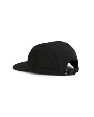 Back view of the black XTM Alpine Puffer Cap showing the adjustable buckle strap and quilted crown