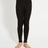 XTM Kids Alpine230 Merino Thermal Pants in Black, front view showing the yellow XTM jacquard waistband