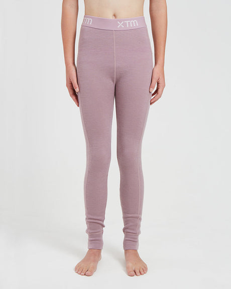 XTM Kids Alpine230 Merino Thermal Pants in Fog, a dusty mauve, front view on a child