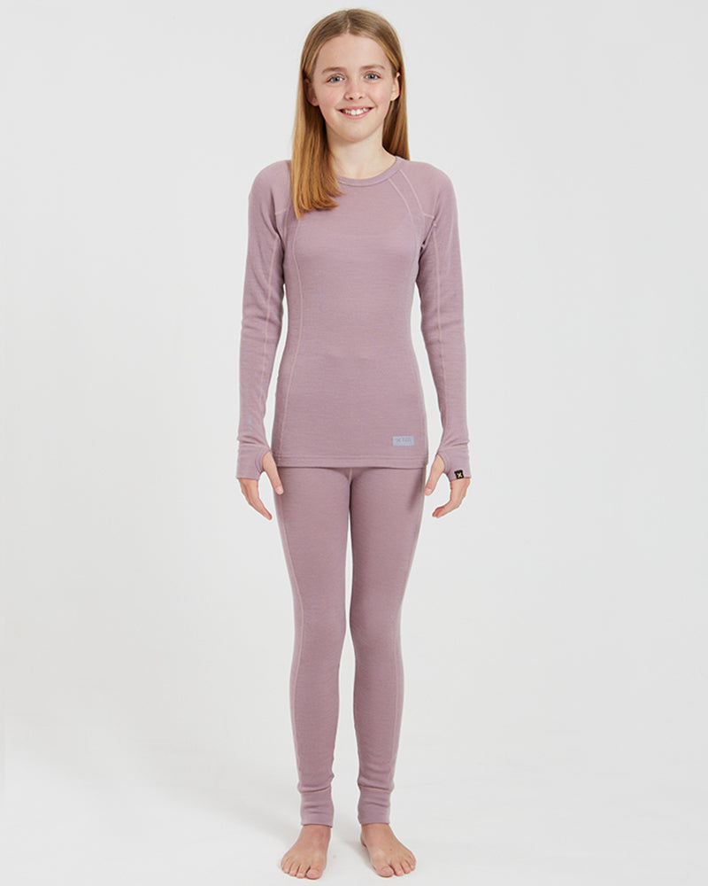 XTM Kids Alpine230 Merino Thermal Pants in Fog, full-length view on a girl wearing a matching thermal top