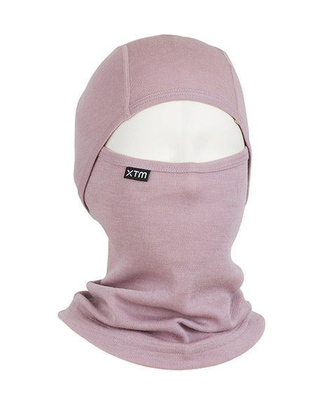 XTM Kids Merino 230gsm balaclava in Fog, a dusty mauve, on a mannequin head with face opening and XTM label