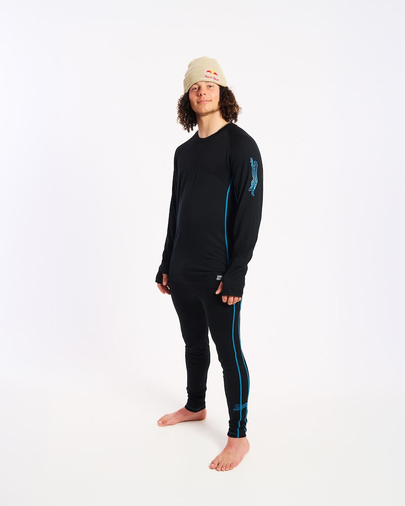 Three-quarter view of the XTM Valentino merino top showing the snow leopard sleeve print