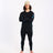 Model in the black XTM Valentino Active200 merino top and matching thermal pants, arms crossed