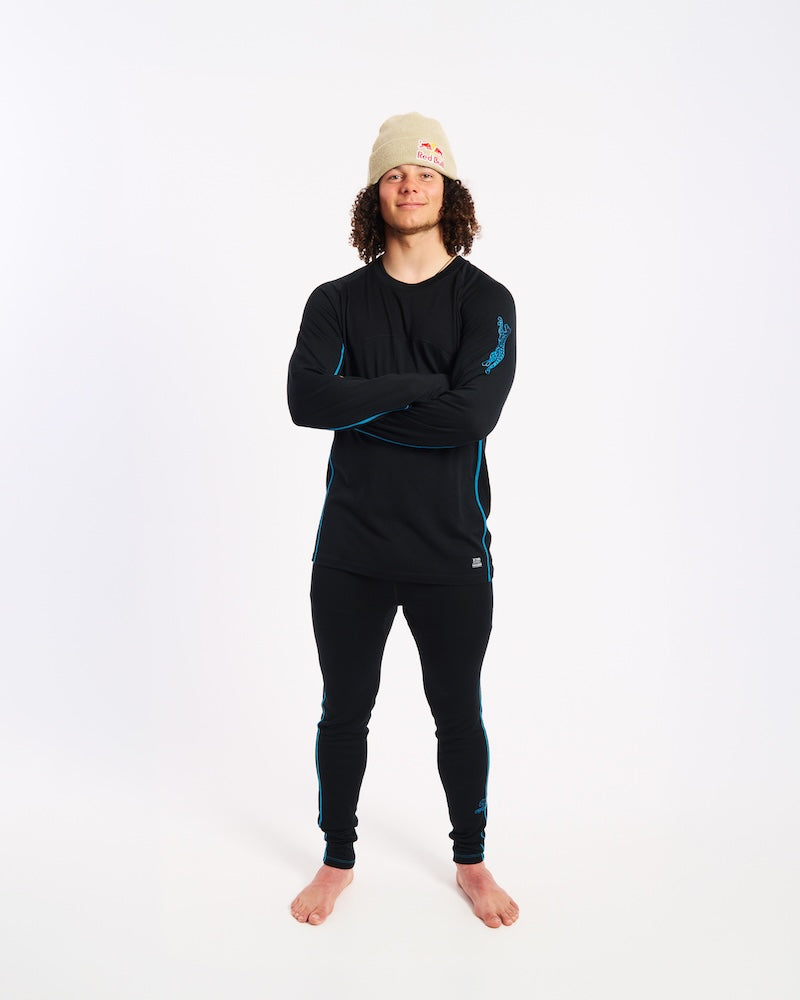Model in the black XTM Valentino Active200 merino top and matching thermal pants, arms crossed