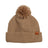 Taupe XTM Dandy merino wool blend beanie with matching yarn pom pom, folded cuff and leather badge