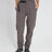 Woman wearing XTM Wye River zip-off hiking pants in Pavement grey with black belt, front view