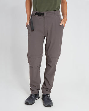 Woman wearing XTM Wye River zip-off hiking pants in Pavement grey with black belt, front view