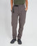 Woman wearing XTM Wye River zip-off hiking pants in Pavement grey with black belt, front view