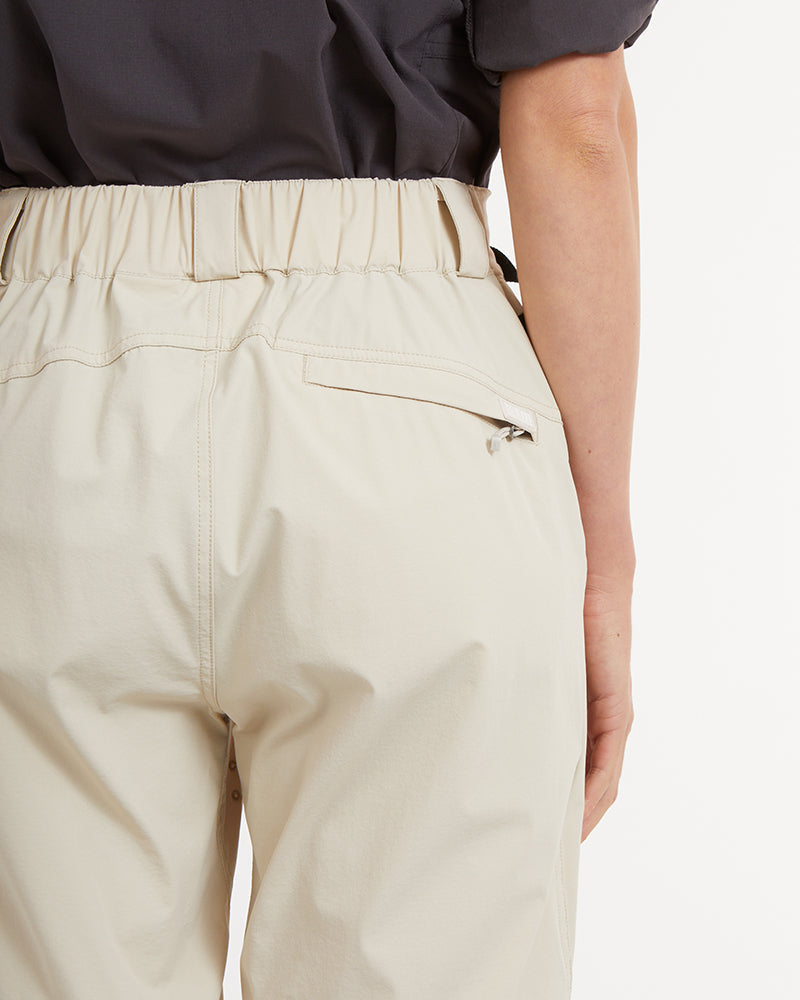 XTM Wye River Sand pants back waist close-up with elasticated back waistband and zipped welt pocket