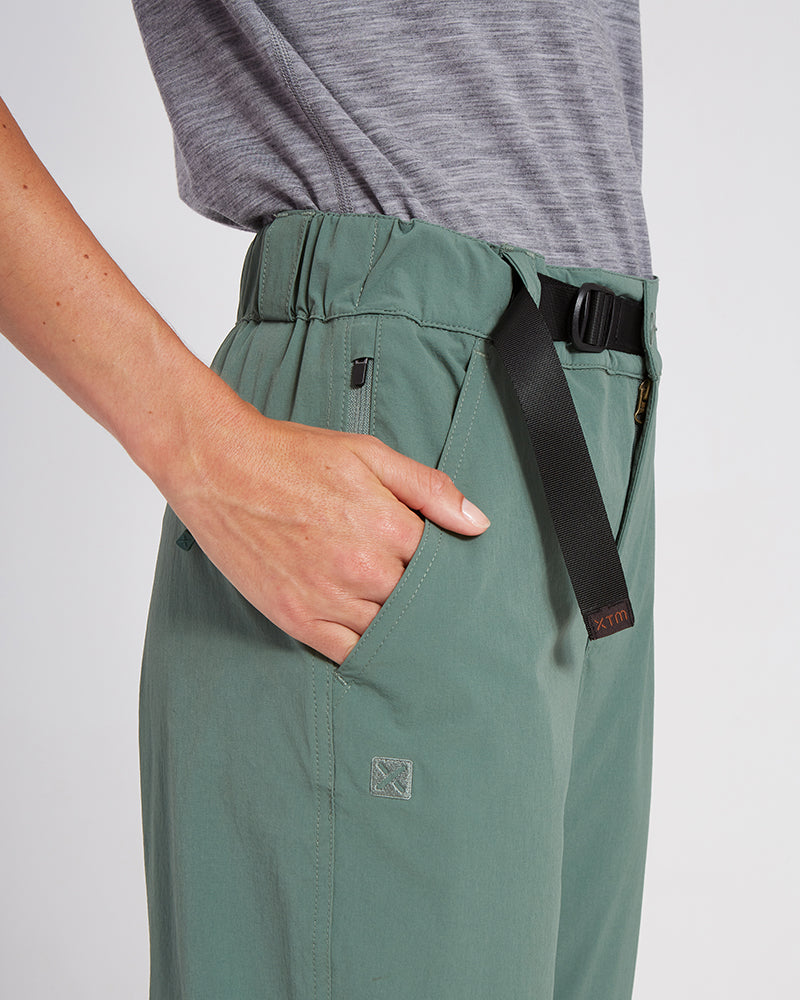 XTM Wye River Spruce Green hiking pants hip close-up with hand in pocket and black belt