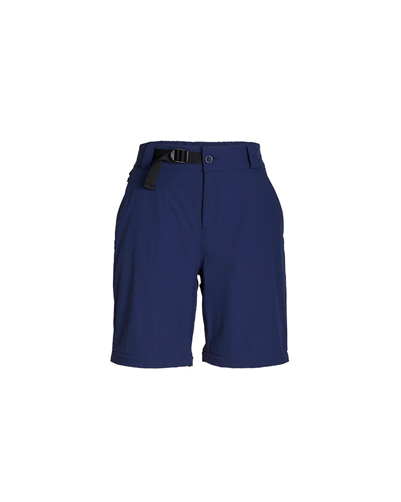 XTM Wye River pant in Naval Blue laid flat with the legs zipped off as hiking shorts