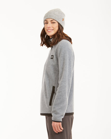 XTM Shelly Light Grey Marle fleece pullover side view showing zip pocket and black hem binding