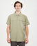 Man wearing the XTM Dunkeld short sleeve hiking shirt in Light Khaki, front view