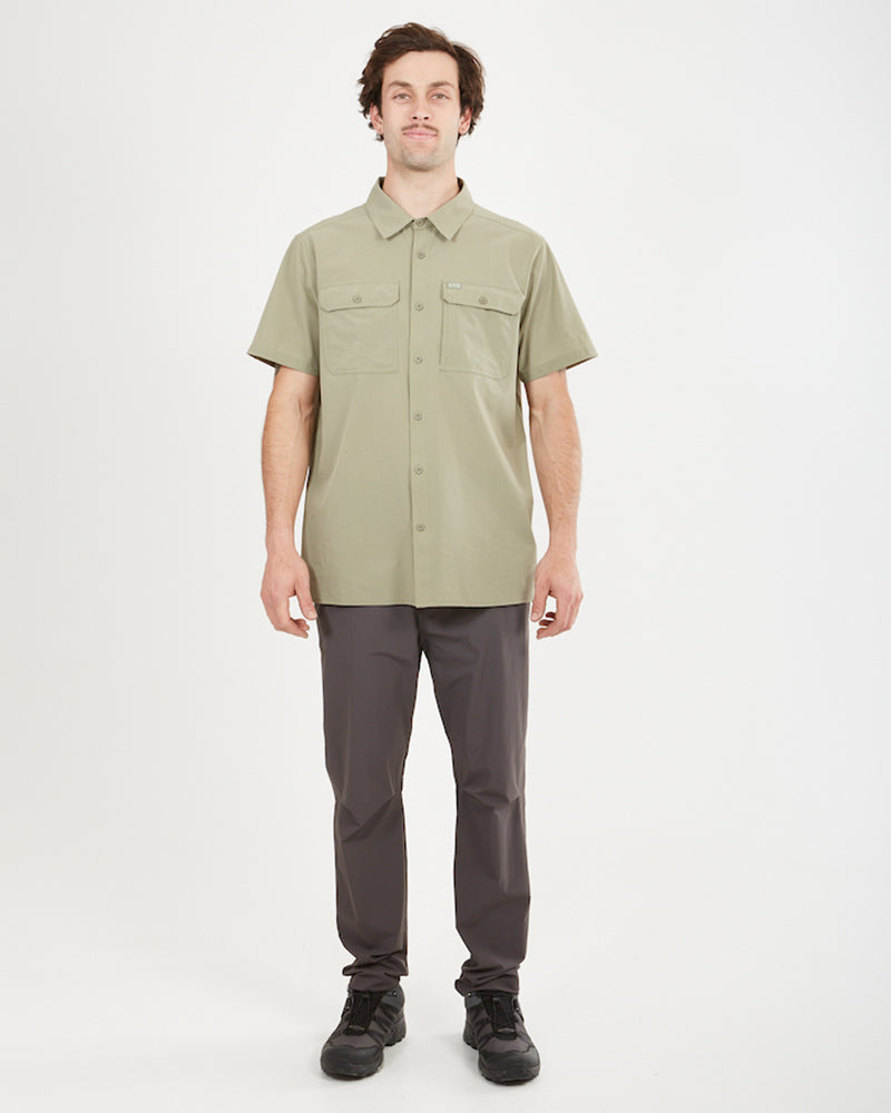 Full-length view of a man in the Light Khaki XTM Dunkeld shirt and grey pants