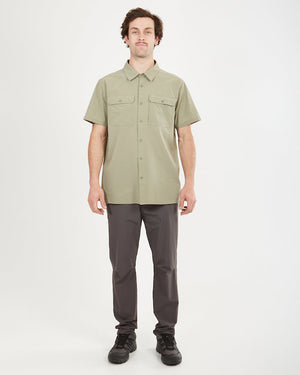 Full-length view of a man in the Light Khaki XTM Dunkeld shirt and grey pants