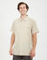 Man wearing the XTM Dunkeld short sleeve hiking shirt in Sand, front view