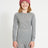 XTM Kids Heatflex Thermal Top in Charcoal Marle, front view on a girl in a pink beanie