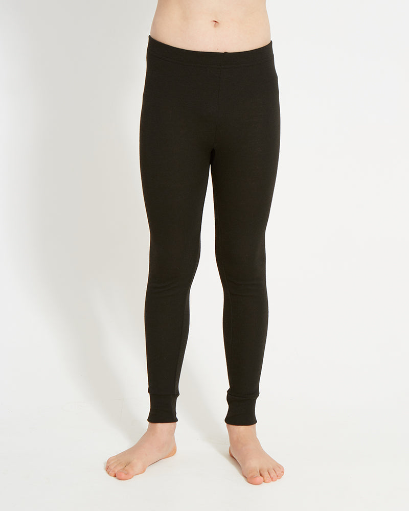 XTM Kids Heatflex Thermal Pant in Black, front view on a child