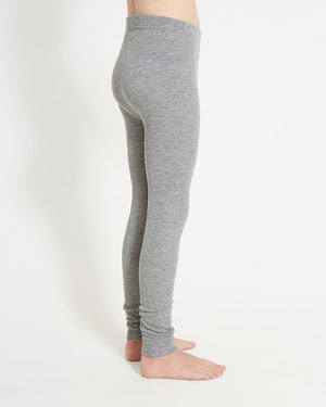 XTM Kids Heatflex Thermal Pant in Charcoal Marle, side view on a child