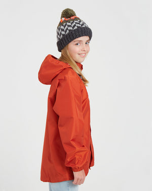 Side view of the XTM Kids Stash 2L rain jacket in Burnt Orange with the hood down