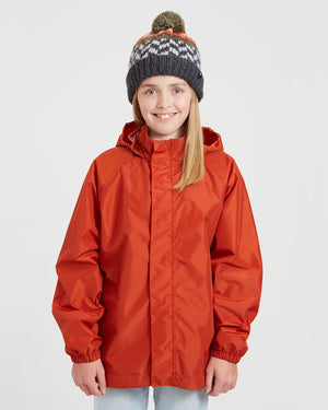 Girl in the XTM Kids Stash 2L rain jacket in Burnt Orange, front view with hood toggles