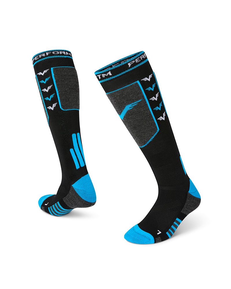 Pair of XTM Valentino technical snow socks in black and blue laid out, inside and outside views